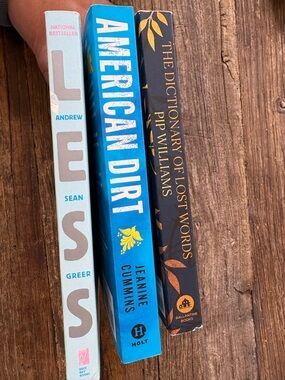 American Dirt by Jeanine, paperback novels: Less, American Dirt, and The